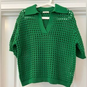 Green open weave sweater.